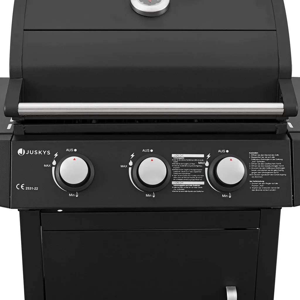 Juskys BBQ Gasgrill Louisiana 8,1 KW Mit 3 Brenner, Grillrost, Deckel Mit Thermometer, Warmhalterost & Seitenablagen – Grillwagen Mit Stahl Korpus 16 Juskys BBQ Gasgrill Louisiana 8,1 KW Mit 3 Brenner, Grillrost, Deckel Mit Thermometer, Warmhalterost & Seitenablagen – Grillwagen Mit Stahl Korpus – Bild 16